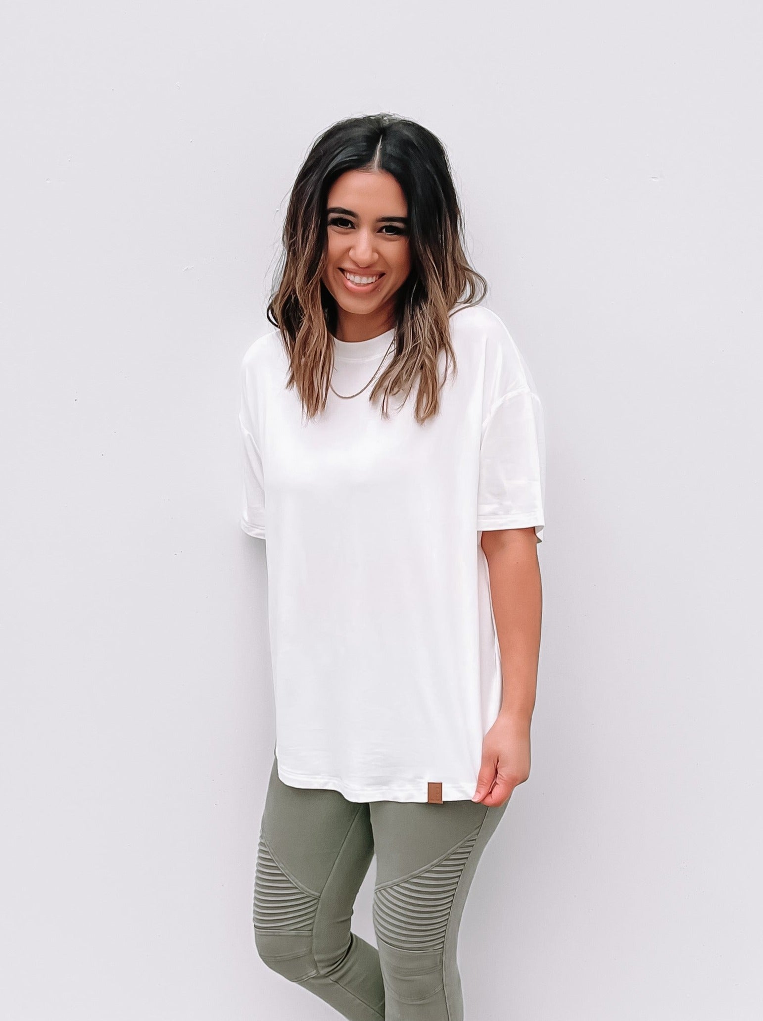 Woman in oversized white bamboo tee