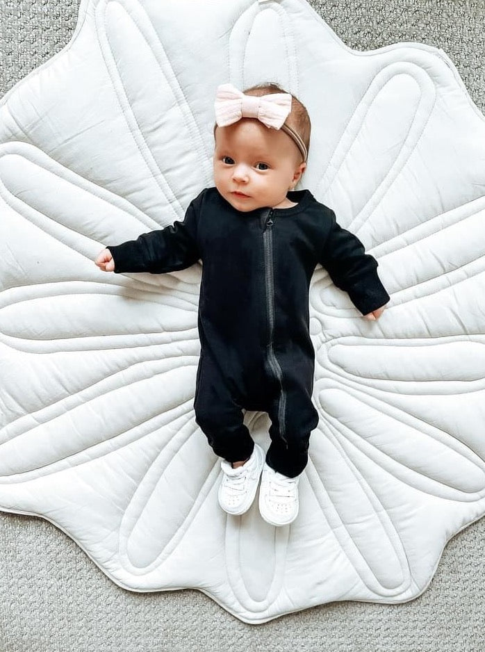 Adorable baby girl in Little Bipsy black romper